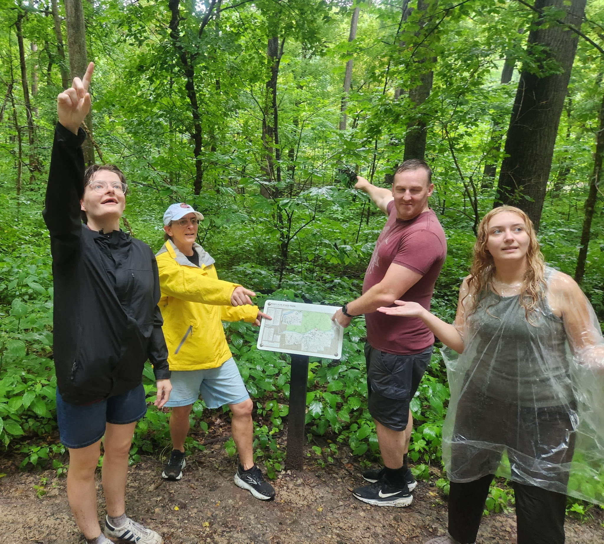 family at Turkey Run wayfinding trail map